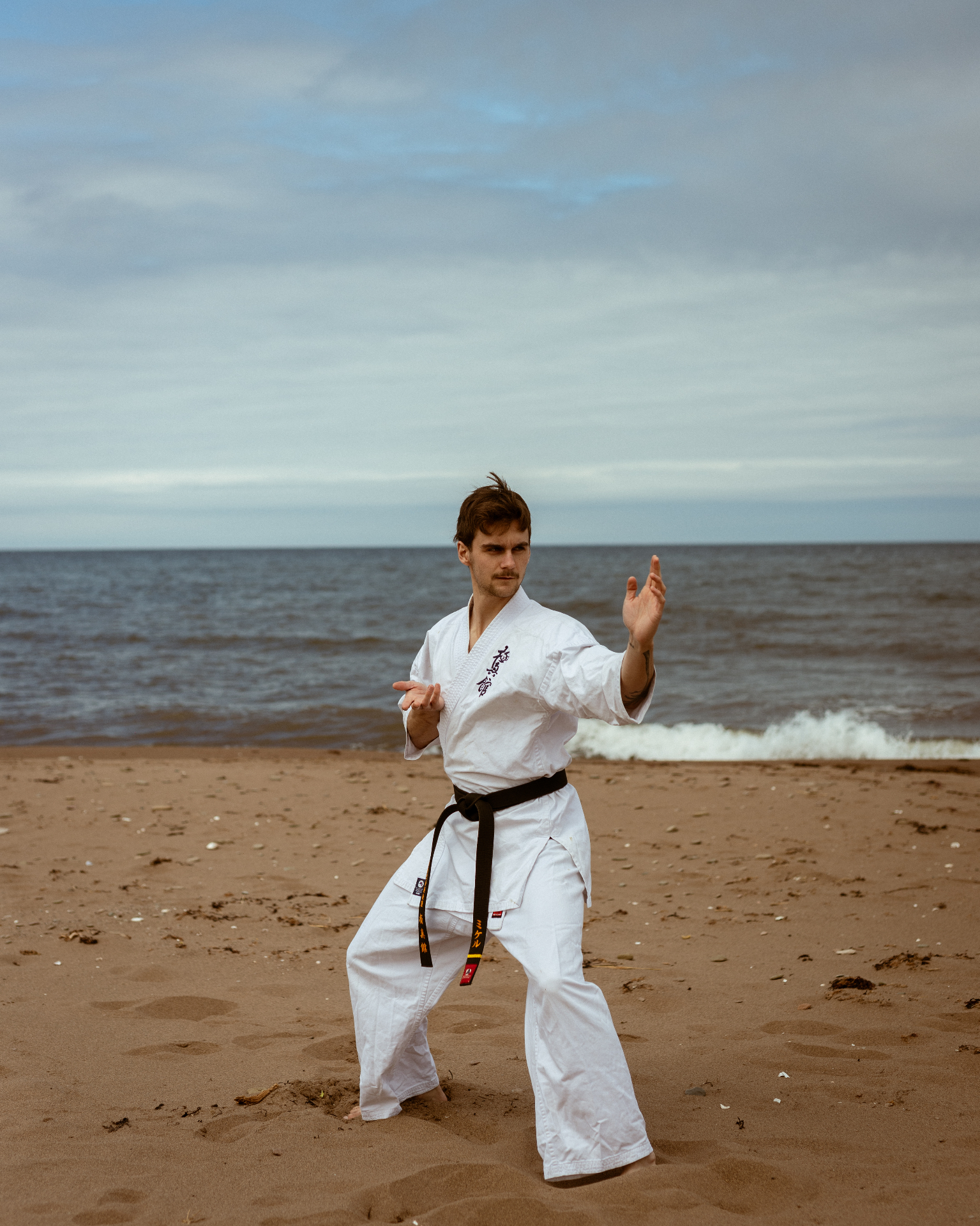 Empty dojo at dawn — gi and obi on the floor
